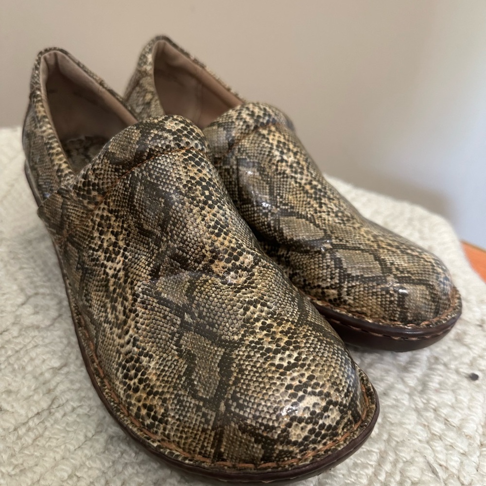 Snakeskin print clogs